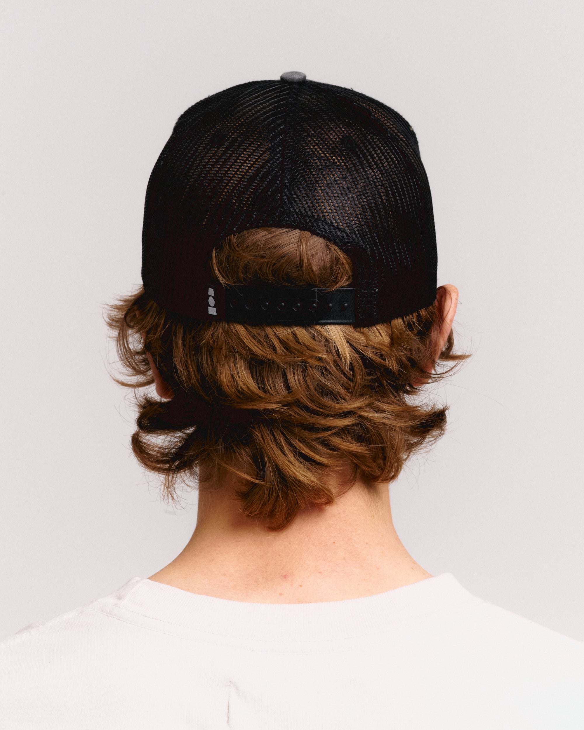 YOUTH ENRICHMENT WASHED TRUCKER HAT