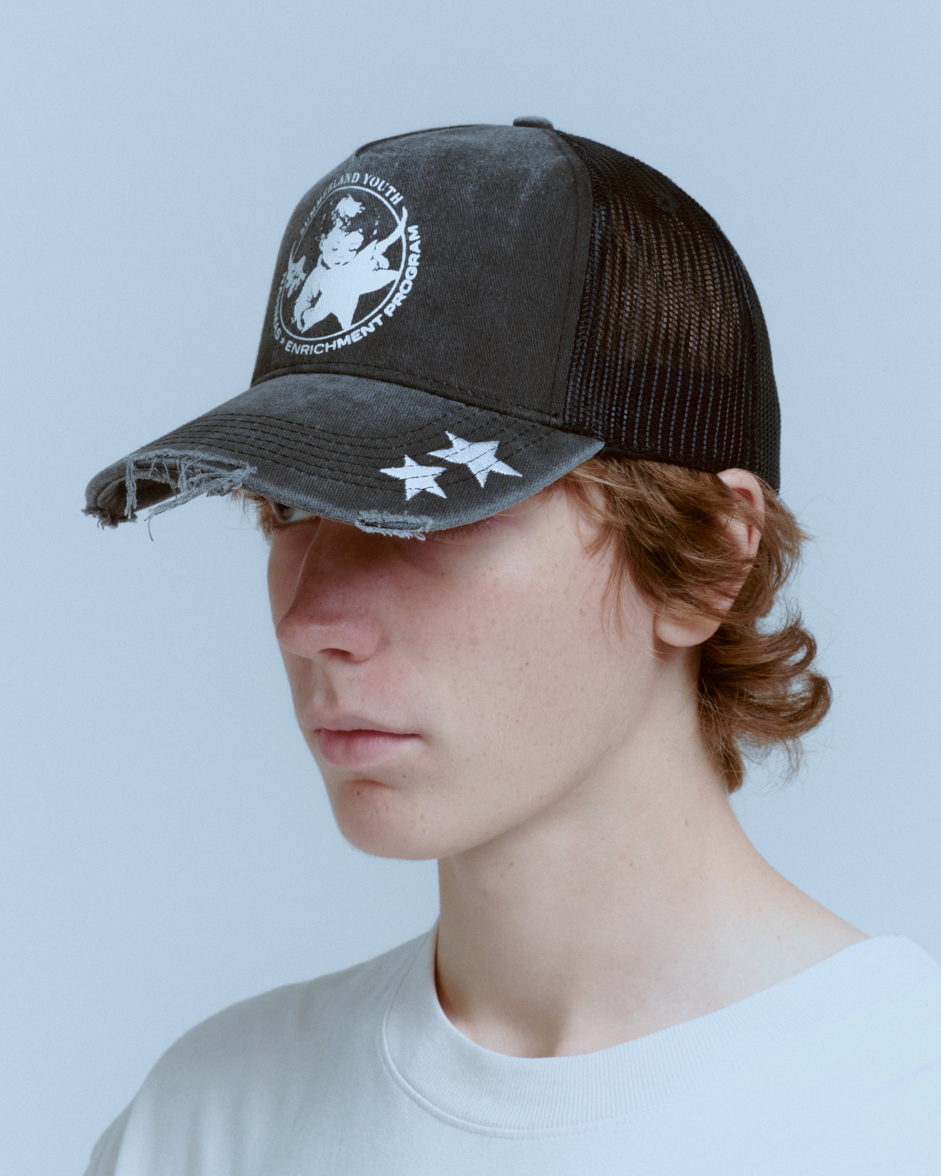 YOUTH ENRICHMENT WASHED TRUCKER HAT – NAHMIAS