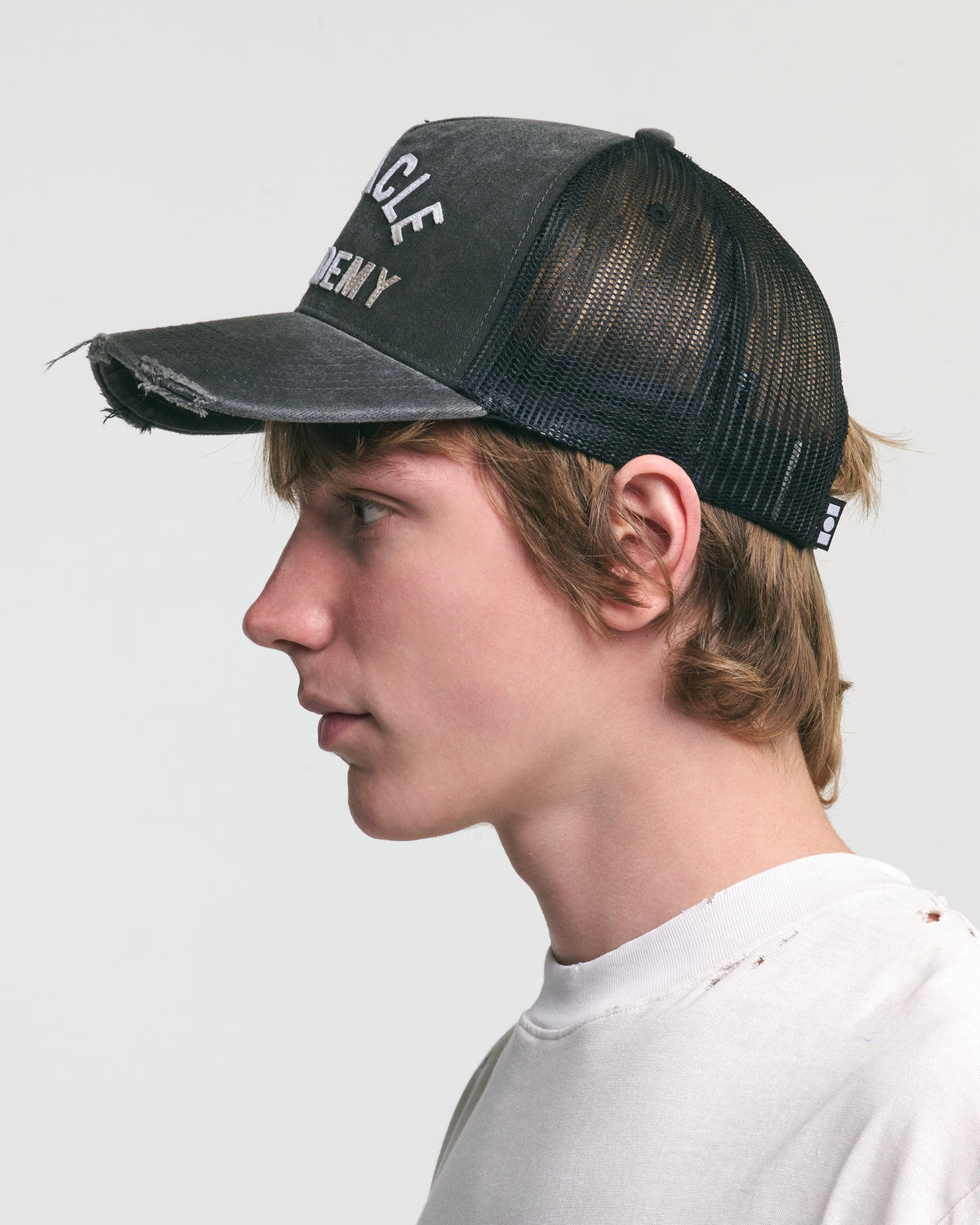DISTRESSED MIRACLE ACADEMY TRUCKER HAT