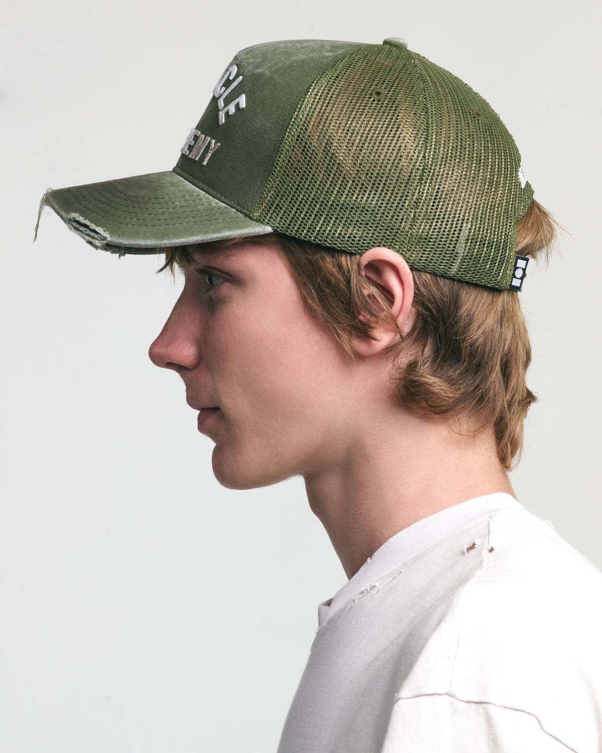 DISTRESSED MIRACLE ACADEMY TRUCKER HAT
